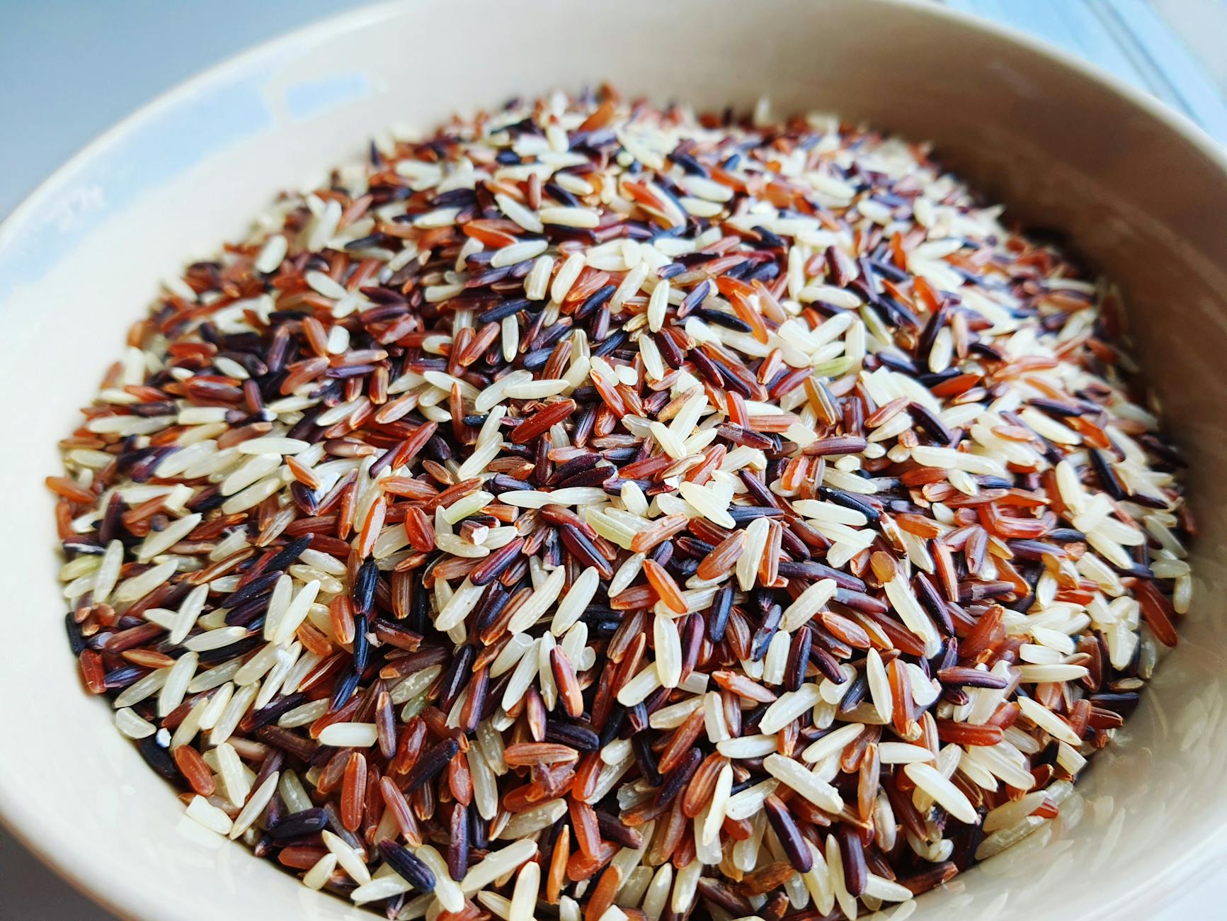 white and brown rice grains on a bowl